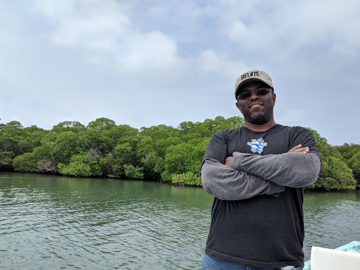 photo Emil Cherrington in Belize in front of mangrove trees