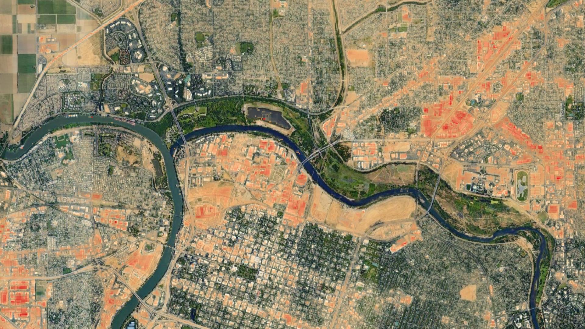 Mean land surface temperature derived from 2016-2020 Landsat 8 OLI/TIRS imagery in central Sacramento, located in the California central valley, is displayed. Orange coloring is used to indicate which areas experience the urban heat island effect, with darker colors indicating a higher magnitude of urban heat. The darkest orange colors indicate areas where the city should invest more in urban cooling infrastructure.   Keywords: Urban heat island, Landsat, California, Central Valley, Sacramento, Nicole Keller, Elspeth Gates, Anjelica Petsch, Karina Alvarez