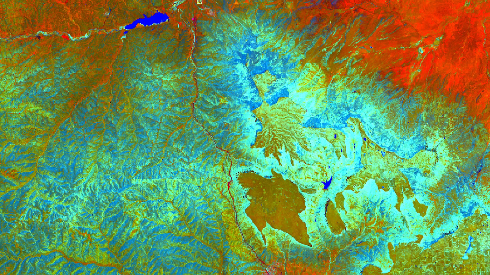 Composite of the area around Fisher's Peak State Park made of the Tasseled Cap coefficients Brightness, Greenness, and Wetness. Coefficients were calculated from a single Landsat 8 OLI TOA image from July 9, 2019. The red, green, and blue bands align with Brightness, Greenness, and Wetness, respectively, to showcase vegetation health and density. Greenness and Wetness are good indicators of biomass, and areas of lush vegetation can be seen in turquoise.   Keywords: Colorado, Landsat, Tasseled Cap, Biomass​