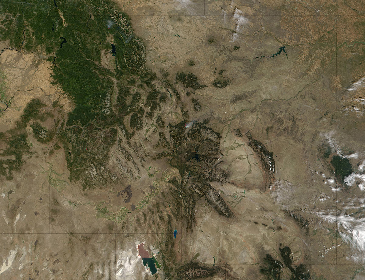 Clear skies over Montana and Wyoming reveal smoke from forest fires burning in the region.