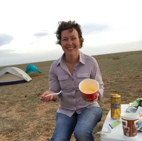 Woman eating noodles in Mongolia
