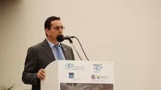 Photo of man (Ricardo Quiroga) speaking at an event