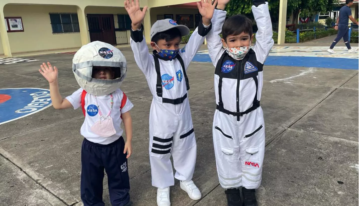 Three students dress as astronauts in anticipation of the amateur radio conversation with the International Space Station. Activities like this help generate awareness and excitement about science in the classroom. Credits: Disaster Fighters