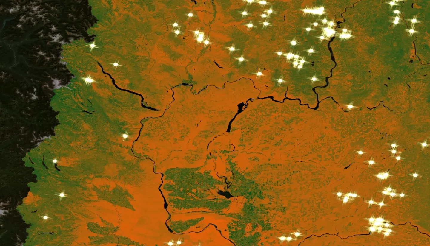This image displays a portion of Eastern Washington State, on the leeward side of the Cascade Mountains. Lightning point data, derived from the ISS Lightning Image Sensor for the year 2018 is overlaid upon 2018 Landsat 8-OLI imagery processed for a Normalized Difference Moisture Index, for the May-October fire season. Sparks symbolize the point coordinates of lightning strikes. The red-orange color shows dry vegetation, while the forest green represents vegetation with a higher moisture content.  Keywords: Amelia Zaino, Ani Matevosian, Amy Kennedy, Evan Bradish, lightning, wildfires, Eastern Washington, vegetation moisture. Background map layer, credit: Esri, DigitalGlobe, GeoEye, Earthstar Geographics, CNES/Airbus DS, USDA, USGS, AeroGRID, IGN, and the GIS User Community