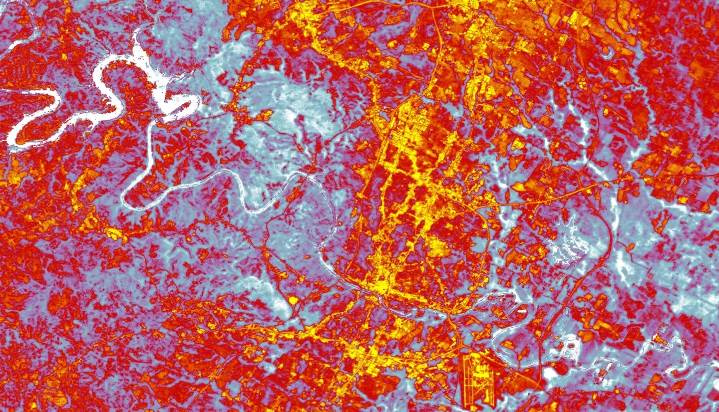 Daytime average land surface temperatures calculated from April-September, 2015 – 2020 Landsat 8 TIRS data. The image shows downtown Austin, Texas, the surrounding Hill Country, and Lake Travis. Red and yellow values represent highest temperatures, while blue and white values depict cooler areas, including the Colorado River system that runs through the city. Yellow areas highlight built-up features associated with higher temperatures, suggesting where partners should focus their efforts on mitigating heat hazards for vulnerable communities.  Keywords: Urban Heat, Land Surface Temperature, Landsat8, Alexa Lopez, Will Peters, Margaret McCall, James Sanders
