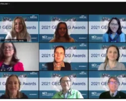 screenshot of 15 people smiling on a video conference