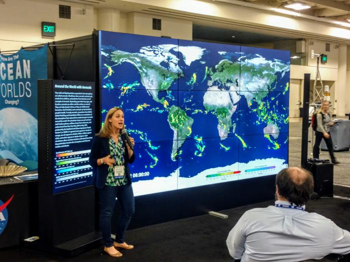 Landslide researcher and Disasters Program Center Coordinator Dalia Kirschbaum gives a presentation on the NASA Hyperwall at AGU 2016.