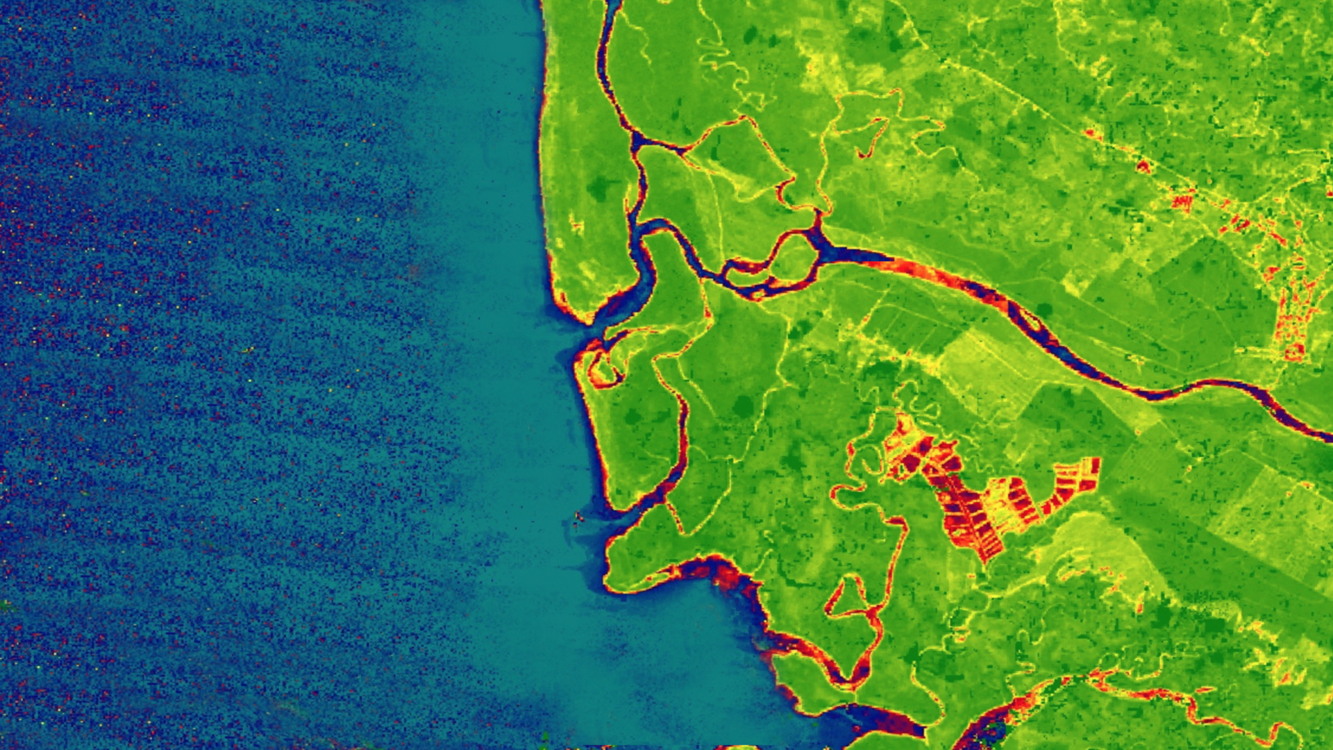Greenest pixel composite of Normalized Difference Vegetation Index (NDVI)-processed image using 2019 data from Landsat 8 Operational Land Imager  blended with a true color band combination (3, 2, 1) of the Western coast of Costa Rica in the Osa region. The areas of highest vegetation are represented in green, areas of lowest vegetation are represented in red, and water is represented in blue. The land cover characteristics shown in an NDVI image improve land cover classification accuracy.  Keywords: NDVI, Landsat, land cover
