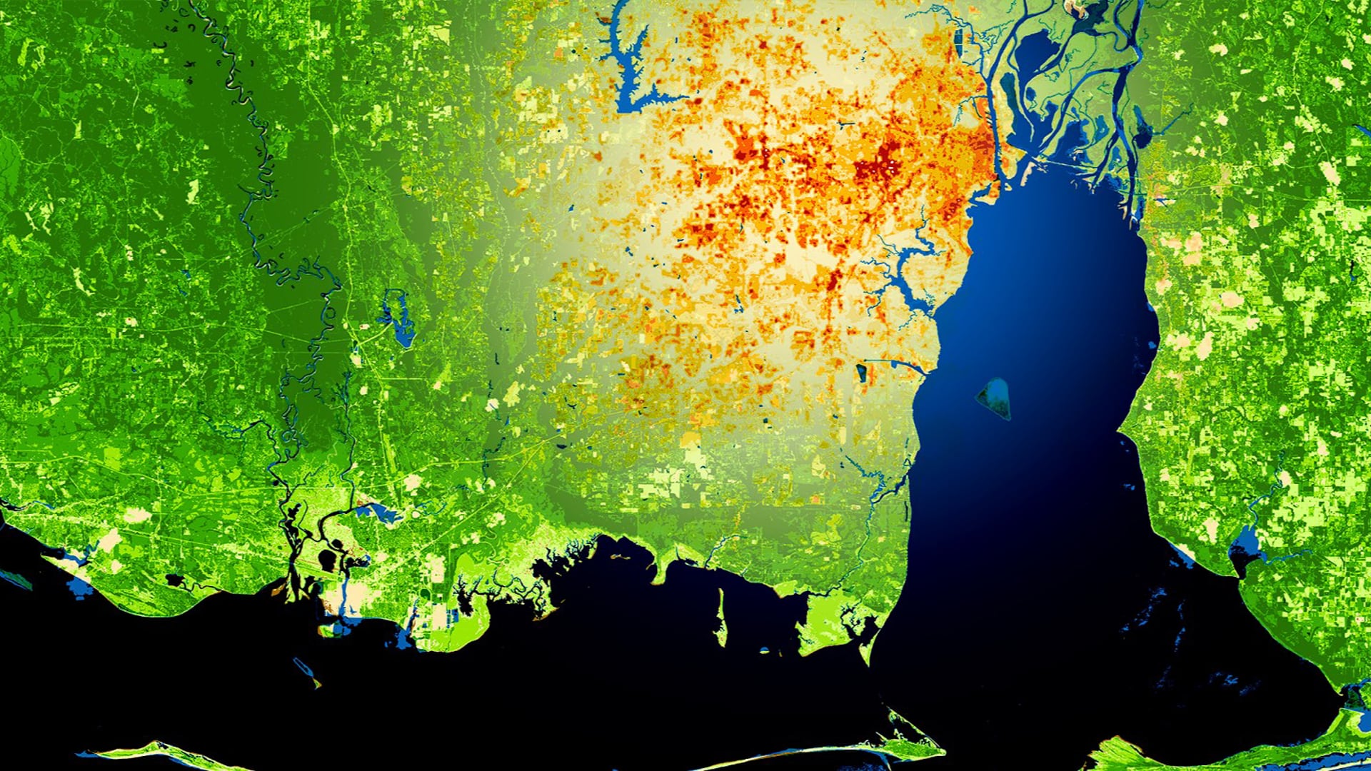 Focused on of the southern half of Mobile County, Alabama, this is an NDVI-processed image overlaid by a land surface temperature (LST) layer obtained from 2019 Landsat 8 OLI/TIRS data. The darker red in the overlay indicate higher LST and lighter yellow shades indicate lower LST. The lighter green tones in the base image represent less healthy vegetation and darker tones represent healthier vegetation. Maps like this help partners identify and mitigate the effects of urban heat islands.