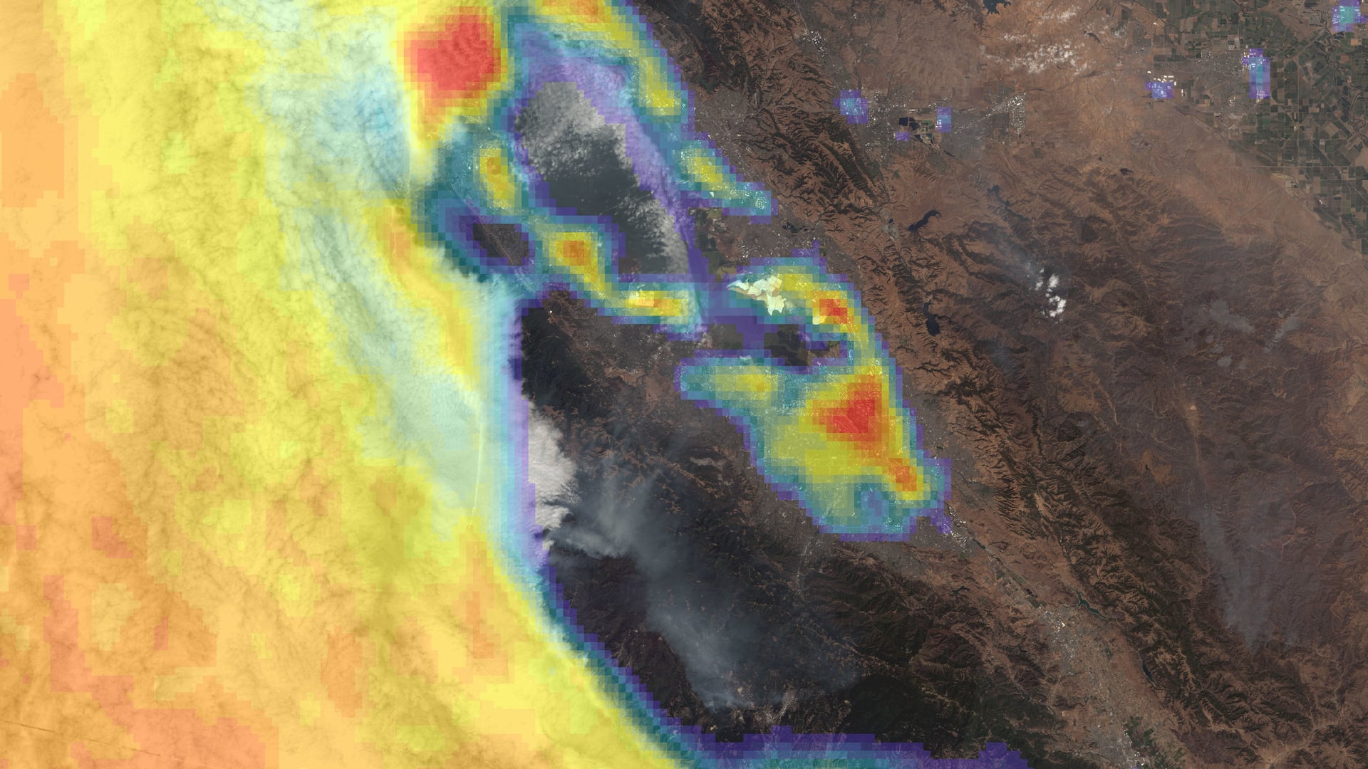 Presence of fog and low cloud cover in July 2020 derived from Terra MODIS data, overlaid on a true color Landsat 8 OLI image of San Francisco Bay, California taken August 2020. Bright red shades represent higher fog frequency, up to 29 days per month, while blue and transparent indicate fewer than 8 days. The presence of fog is vital for coast redwood trees and projecting future fog presence can support redwood habitat conservation efforts.   Keywords: MODIS, fog, cloud, climate change, coast redwood (Sequoia sempervirens), San Francisco Bay, California