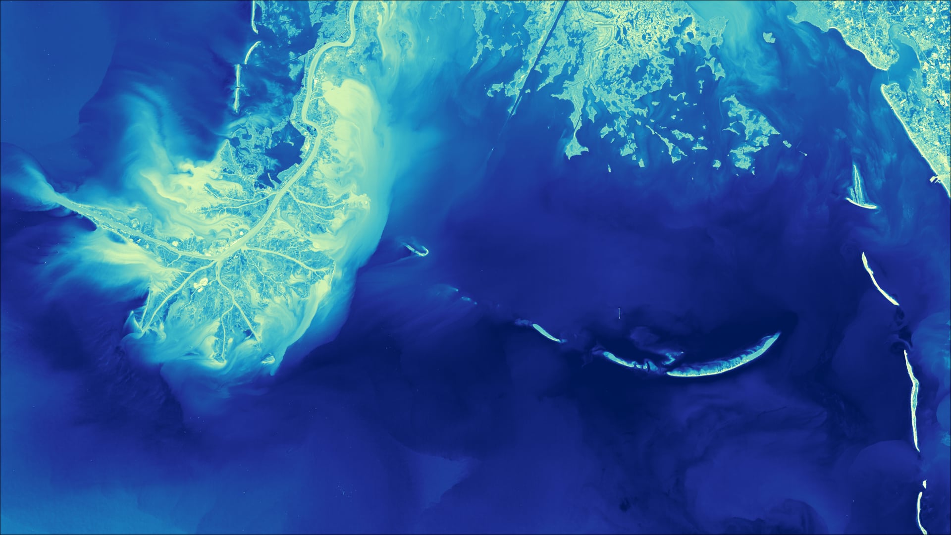 Turbidity processed imagery using 2020 Landsat 8 OLI/TIRS data. The Chandeleur Islands located on the southeastern coast of Louisiana are displayed. Shades of yellow indicate areas with high turbidity and darker shades of blue indicate areas with low turbidity. Concentrating on areas with higher turbidity allows the coastal restoration experts to know where land erosion occurs and identify ideal areas for seagrass revegetation.  Keywords: Water Resources, Turbidity, Seagrass, Breton National Wildlife Refuge (BNWR), Chandeleur Islands, Louisiana