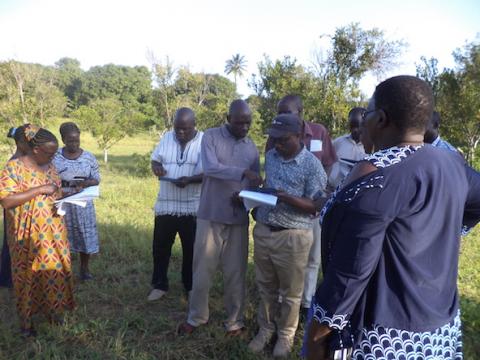 Remote Sensing Expert Antony Ndubi, center, helping participants during fieldwork training.  