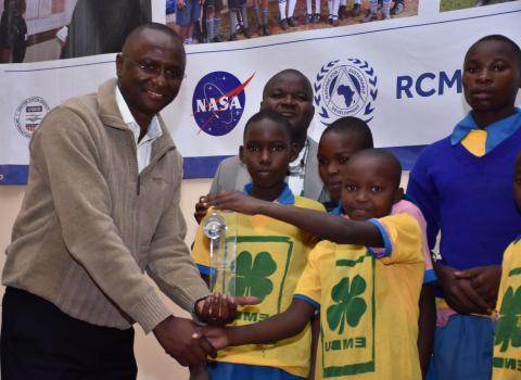 Image of African Children being handed an award