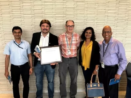 Vernier stands with NASA’s Langley Research Center colleagues after receiving a group achievement award for international collaborative efforts in balloon-borne observations (project BATAL). From left to right; Amit Pandit, Jean-Paul Vernier, Duncan Fairlie, Hazel Vernier, Murali Natarajan