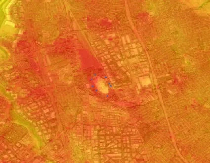 satellite image of city with multiple shades of orange