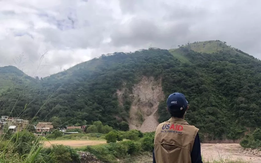 A humanitarian worker from USAID observes the impacts of a landslide. USAID deployed an elite Disaster Assistance Response Team on Nov. 17, 2020, to lead the U.S. response to Hurricanes Eta and Iota. Credits: USAID’s Bureau for Humanitarian Assistance