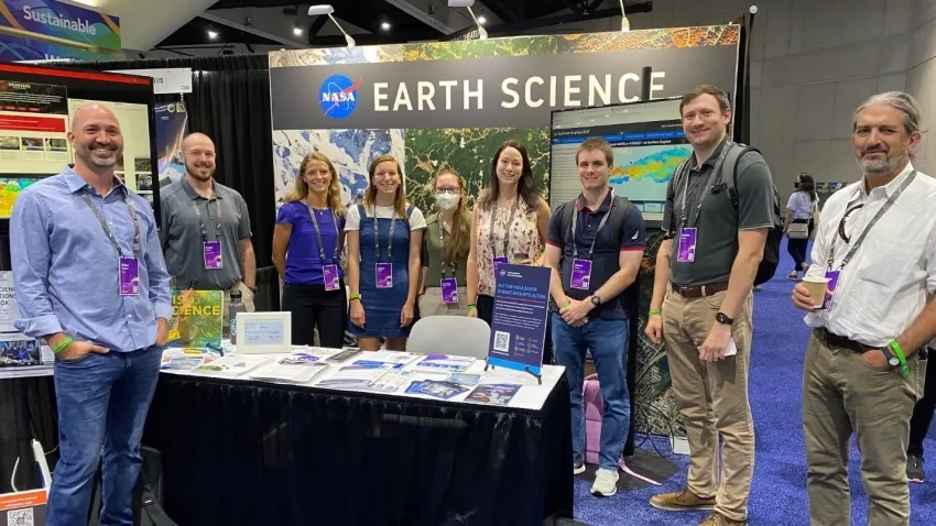 NASA’s Earth Science Division staff a booth at the 42nd Esri User Conference, July 11-15, 2022, in San Diego, California. (Standing left to right: Brian Tisdale, Brady Helms, Leah Schwizer. Allison Alcott, Rachel Soobitsky, Ronan Lucy, Garrett Layne, Stinger Guala.) Credits: NASA