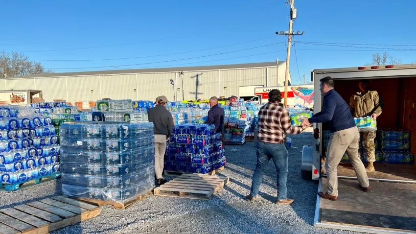 Volunteer emergency crews hand out supplies at a donation center at the Mayfield-Graves County Fairgrounds in Mayfield, Kentucky, Dec. 13, 2021. Credits: Timothy “Seph” Allen, NASA Disasters