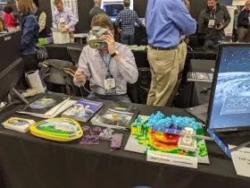 Jacob Reed of NASA’s Disasters Program sets up a VR demonstration for the Exhibit Hall at AGU’s 2019 Fall Meeting. 