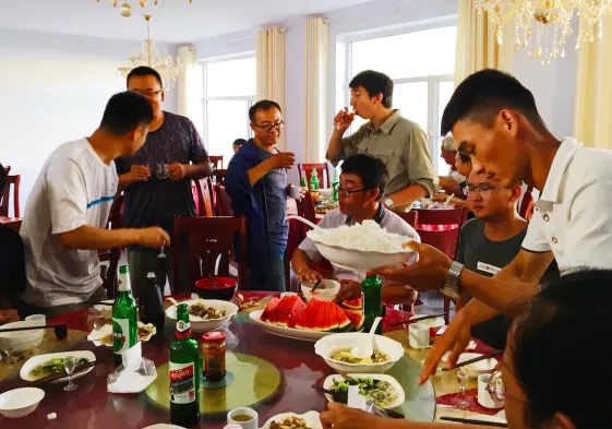Photo of people eating Chinese food in China