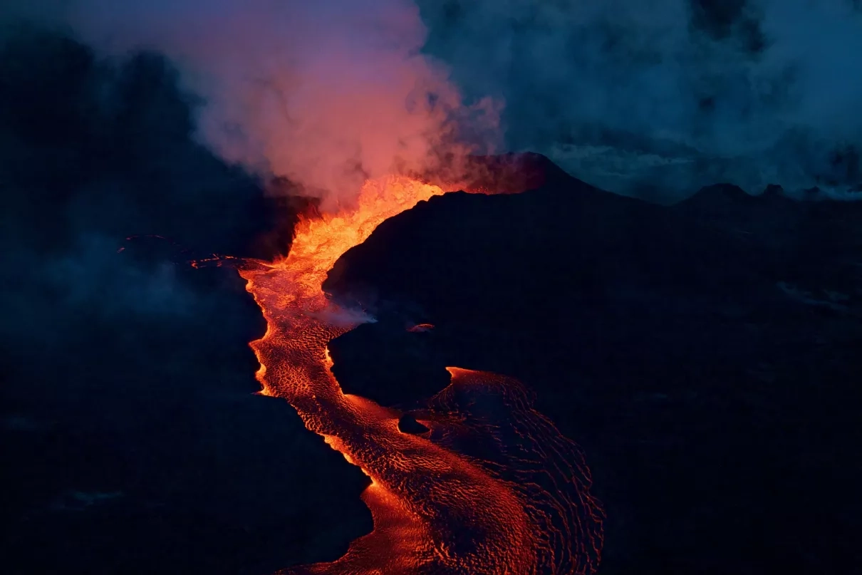 Lava flowing in an early morning photo of Mt. Kilauea, on the island of Hawaii, on June 28, 2018. 