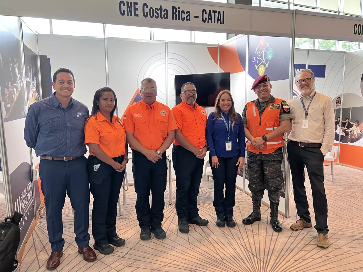 From left to right, Ricardo Quiroga from NASA’s Disasters program stands with Yariela Tañón, deputy manager of SINAPROC-Panama, Carlos A Rumbo,director of SINAPROC-Panama, Jaime Posso, administrative director of SINAPROC-Panama, Claudia Herrera, executive secretary of CEPREDENAC-SICA, Colonel Manuel Gualberto López,  general director of Integral Risk Reduction Management at Defense Ministry-Guatemala; and  Charlie Huyck, executive vice president of ImageCat Inc.,  at the 3rd Regional Simulation of Disaster 