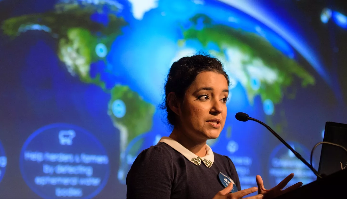 Africa Flores, Land Cover and Land Use Change Theme Lead for SERVIR, speaks during the 2018 Annual Earth Science Applications Showcase