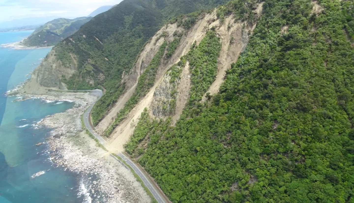 Photograph showing landslides covering State Route 1 near Ohau Point, New Zealand. Credits: USGS, Jonathan Godt