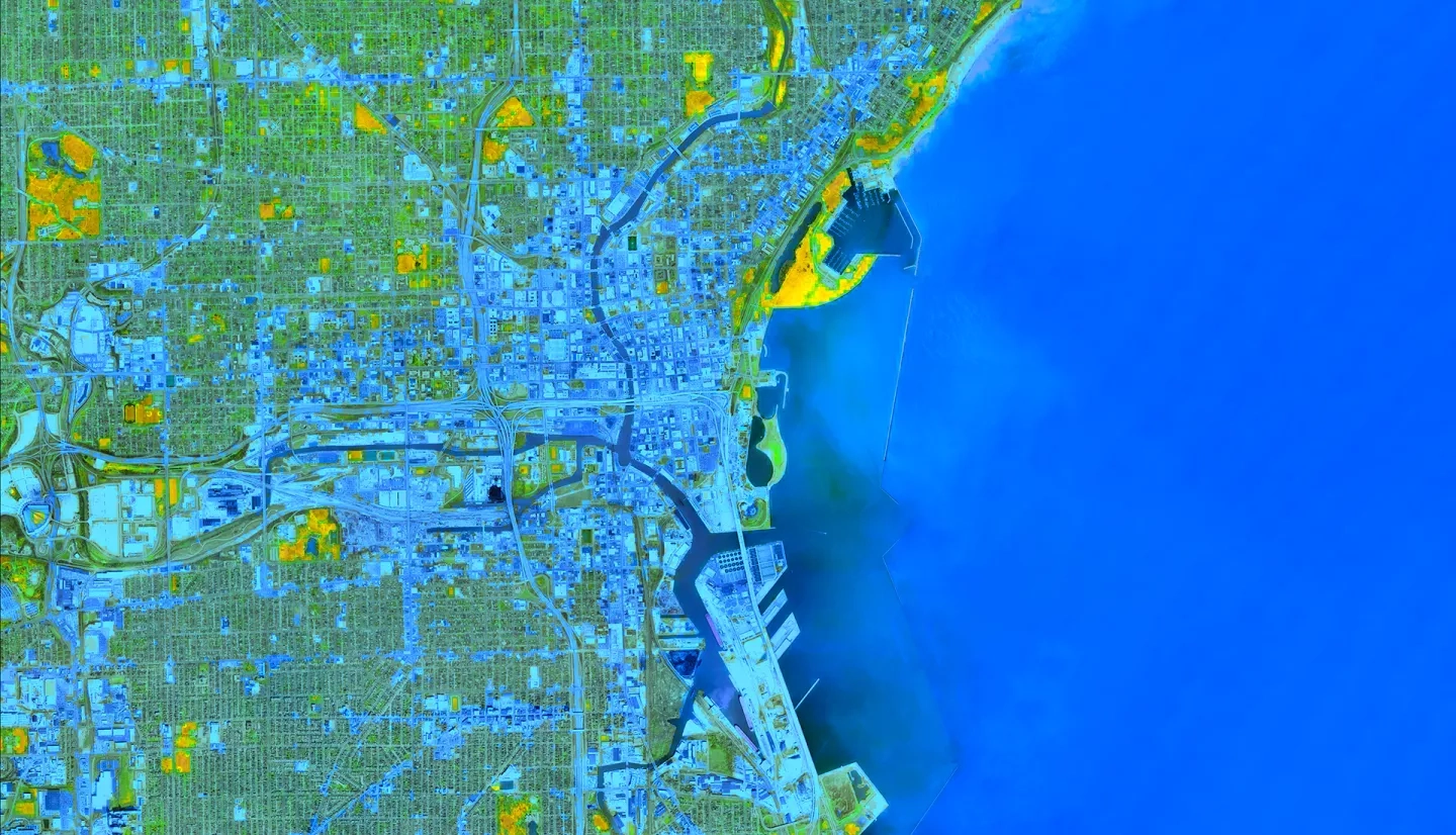 NDWI-processed image derived from Landsat 7 ETM+ data captures the aftermath of a 3-inch rainstorm in Milwaukee, Wisconsin. The composite image shows inundated areas in blue and dried areas in orange a few days after an April 2015 storm. In conjunction with hydrological models, satellite imagery allows the city to identify areas needing flood mitigation strategies.