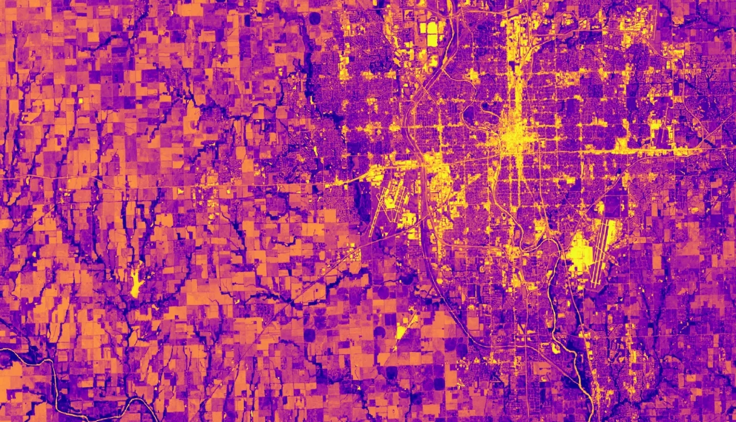 NDVI-processed imagery from Landsat 8 OLI data. This composite image of Wichita, KS, was created using 2018–2022 summer imagery. Lighter shades of yellow indicate limited vegetation in built-up areas and bodies of water, while darker shades of purple indicate dense vegetation. Understanding the spatial distribution of vegetation, such as tree canopy, is essential to recognizing and mitigating heat risk and prioritizing intervention.​
