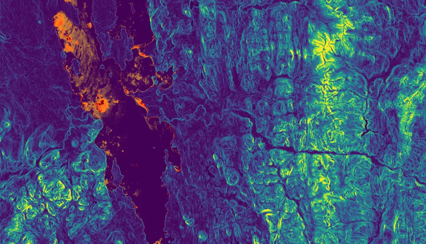 Top layer: NDTI processed imagery of Lake Champlain derived from Landsat 8 TOA data (5/1/21 - 9/30/21). Bright orange and red represent areas of greater turbidity, which often corresponds to algal presence, whilst dark areas indicate low turbidity. Bottom layer: Slope imagery from SRTM (last updated 11/2018) of the Lake Champlain Watershed. Yellow shows areas with higher slopes with a greater risk of phosphorus runoff, while blue shows areas with a lesser slope.