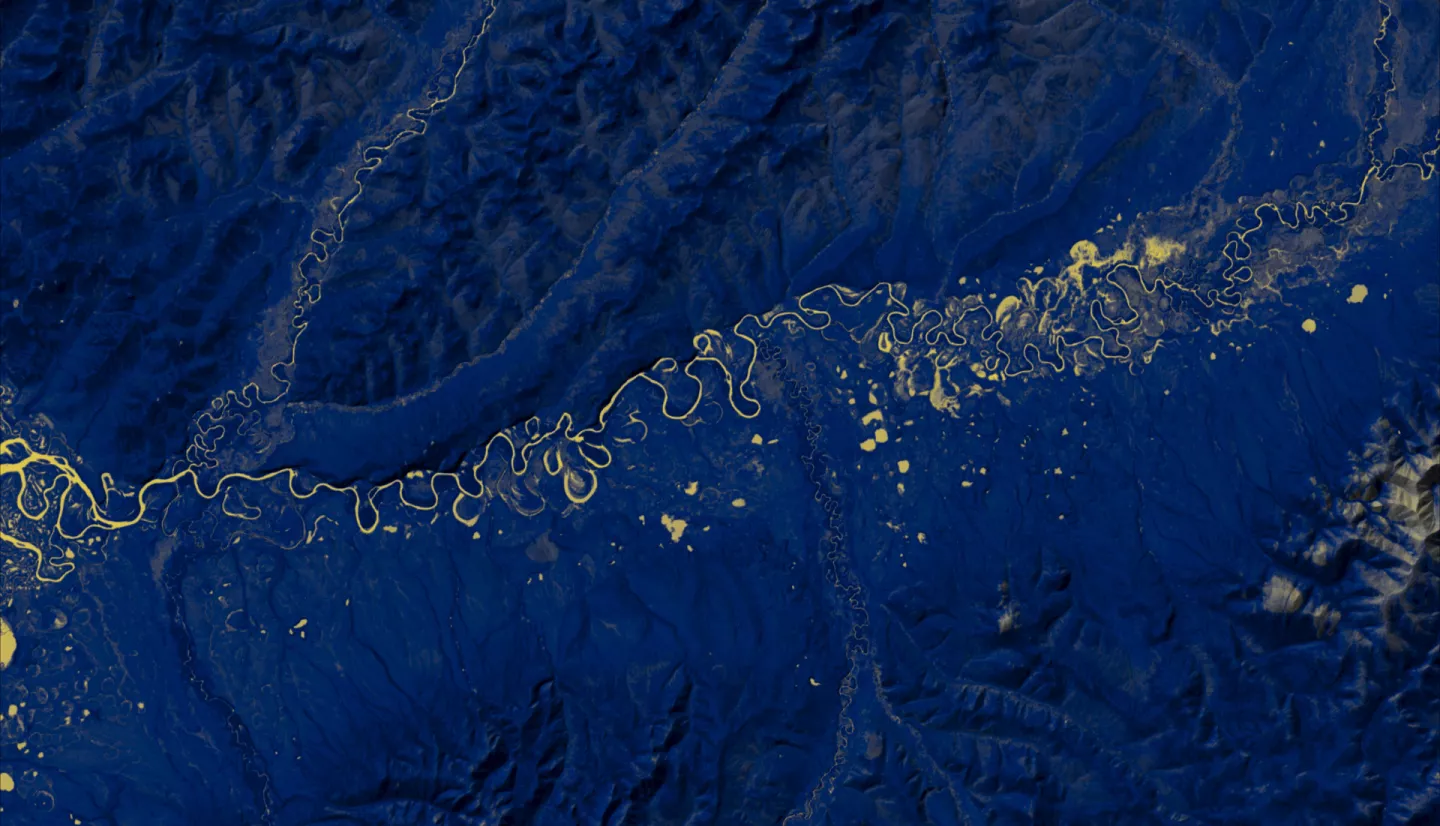 Normalized Difference Water Index (NDWI) to visualize drainage networks around the Unalakleet River in Alaska, calculated from an August 2021 Landsat 8 OLI image. Yellow represents standing or flowing water and potential flood zones, while the dark blue represents drier, upland regions. Unalakleet's climate resilience planning prioritizes relocation to upland regions while avoiding areas that have experienced significant permafrost degradation.