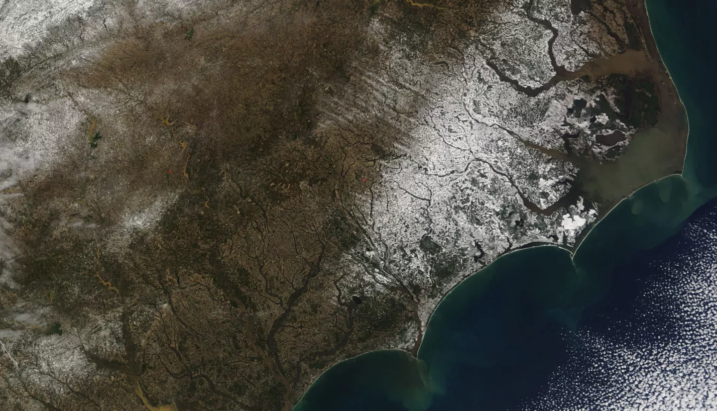 A blanket of white snow covers coastal North Carolina in this natural-color Aqua MODIS image from February 14, 2010.
