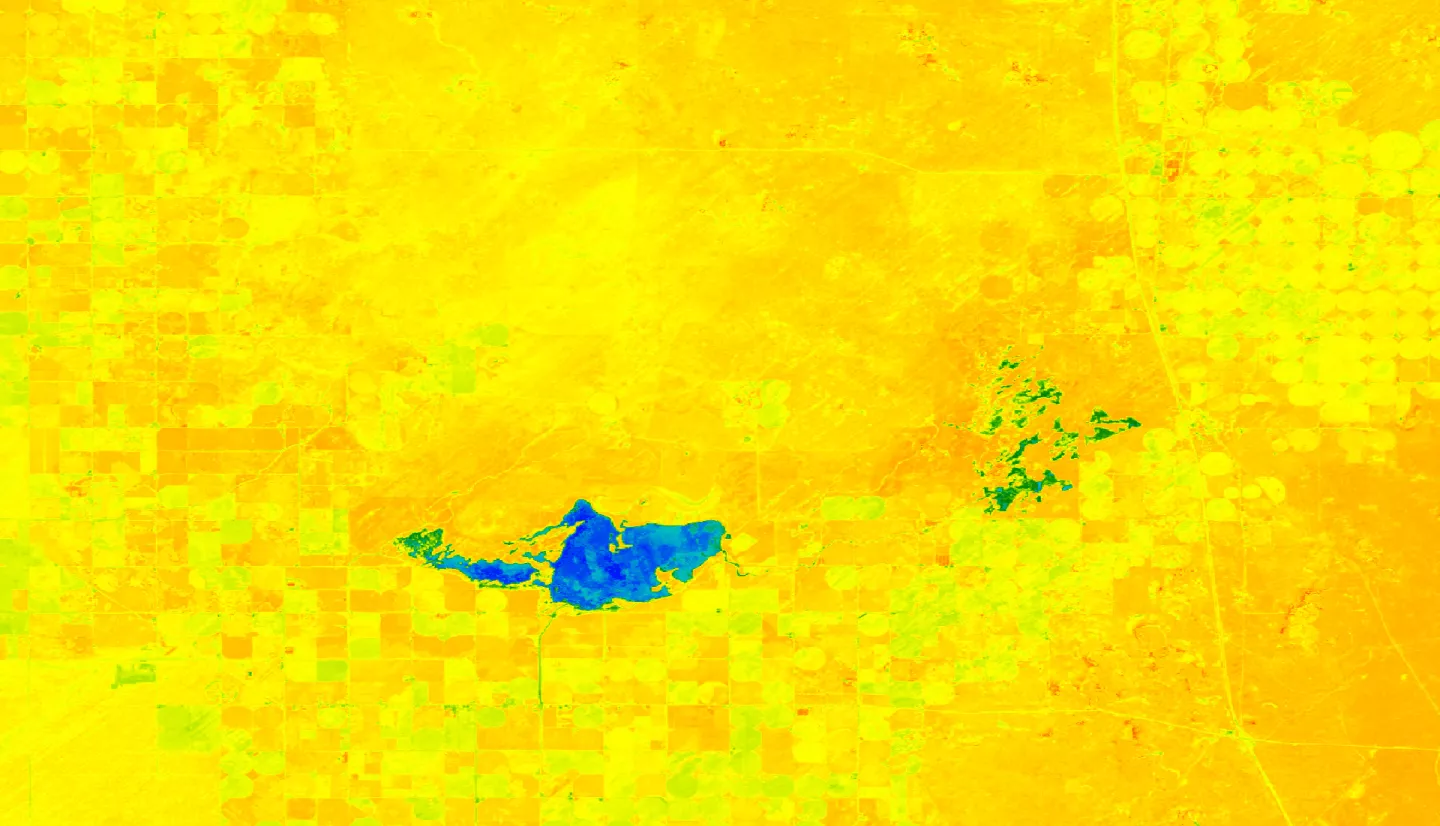  MNDWI-processed imagery from Landsat 8 OLI. This composite image of Mud Lake Wildlife Management Area and Camas National Wildlife Refuge in Southeast Idaho was taken over April and May, 2018. Higher values, blue and dark green shades, indicate surface water. Lower values, red and orange shades, indicate bare ground or senesced vegetation. Yellow and light green indicate living vegetation, such as irrigated crops. Areas with high MNDWI values can help identify wetlands' surface water.