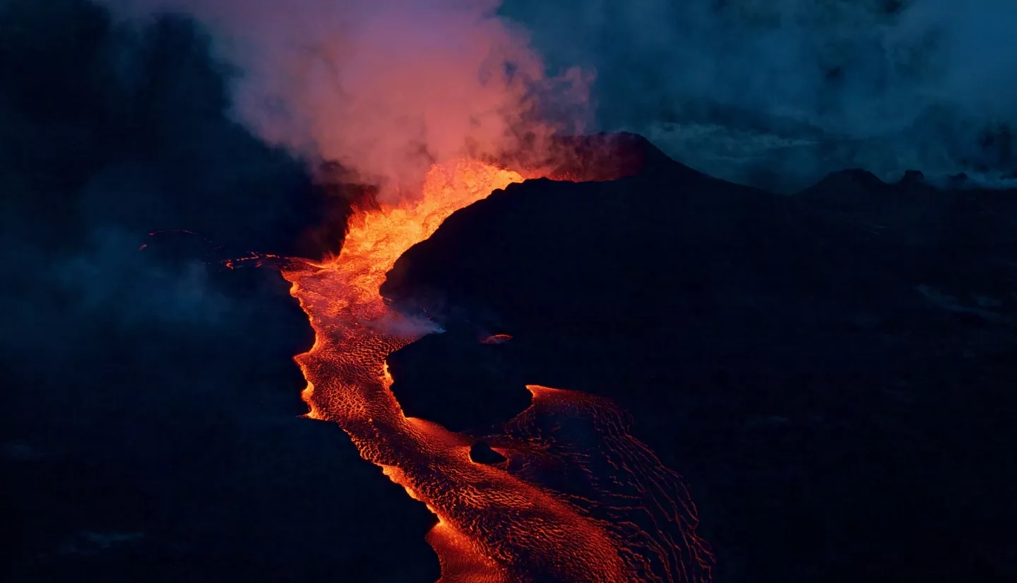 Lava flowing in an early morning photo of Mt. Kilauea, on the island of Hawaii, on June 28, 2018. 
