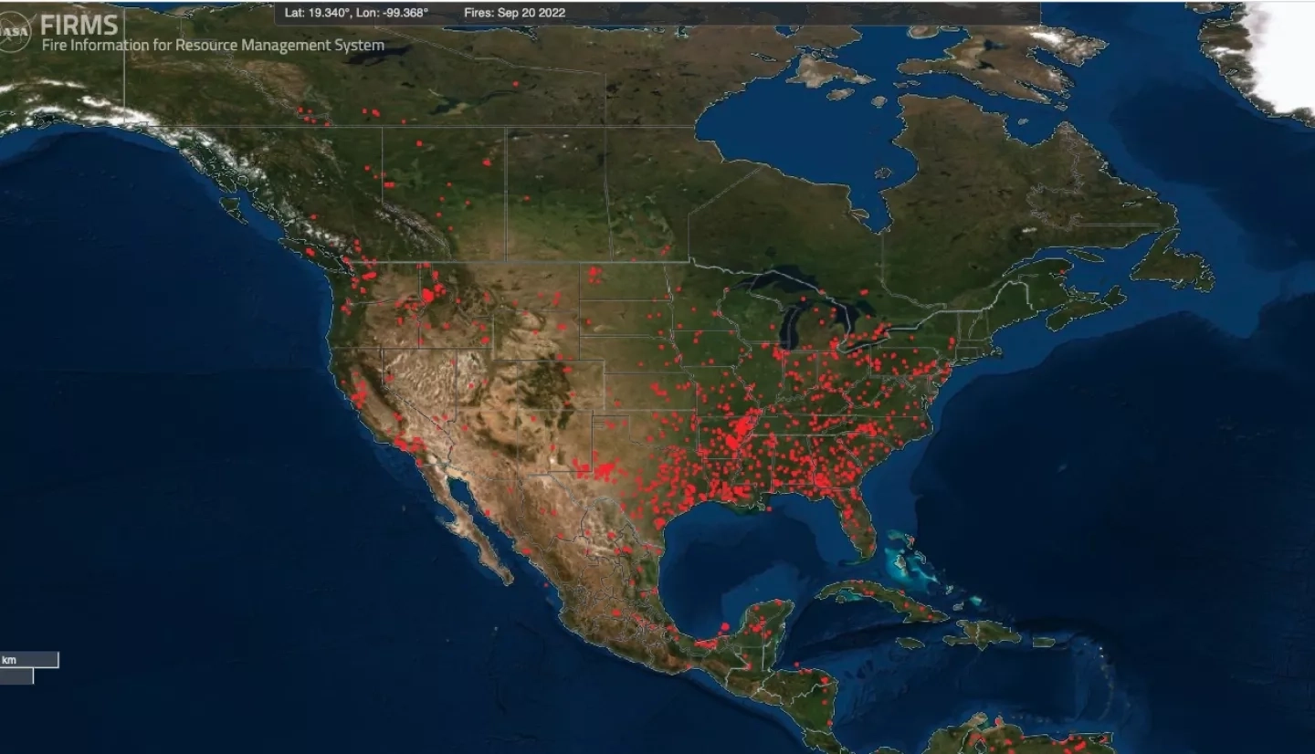screenshot of the FIRMS website of a map of the U.S. with red dots showing fire hotspots as identified by satellite data