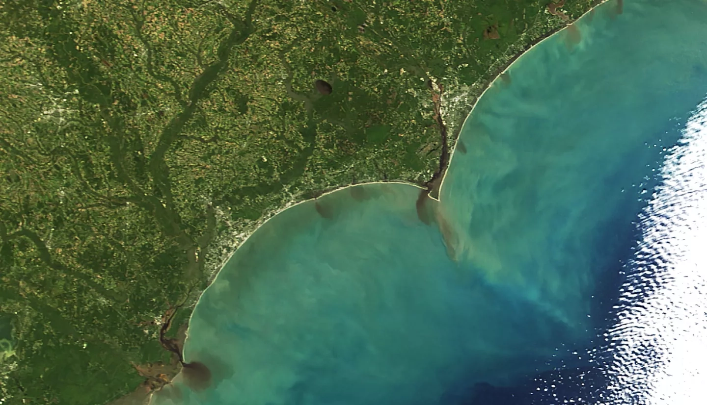  On October 9, 2016, the Moderate Resolution Imaging Spectroradiometer (MODIS) on NASA’s Terra satellite captured this image of floodwaters laden with sediment pouring out from several rivers in North Carolina and South Carolina.