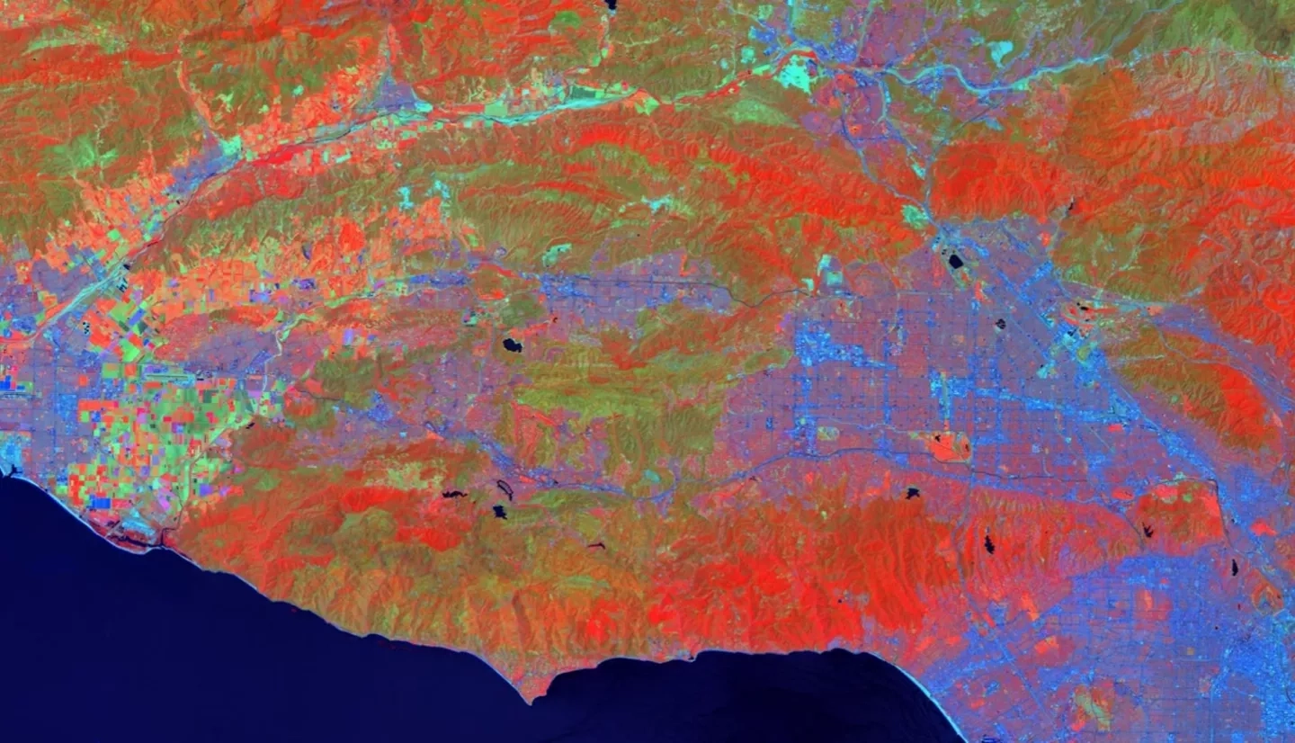 Image taken from Landsat 8 OLI on July 1, 2019, showing NDVI in the red band, shortwave infrared 2 (band 7) in the green band, and coastal aerosol (band 1) in the blue band. Areas of red indicate vegetated areas, greener areas are burn or bare soil areas, lighter blues are developed areas, and the dark blue indicates water bodies. We used NDVI to find areas of recovering vegetation in the Santa Monica Mountains Area.