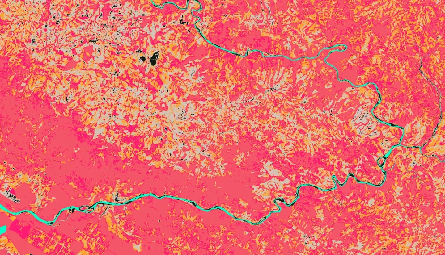 The Enhanced Vegetation Index (EVI) quantifies vegetation greenness over a dense canopy section of Southern Costa Rica using a Landsat 8 OLI composite from 11-01-2018 through 12-31-2019. The coral to pink hues indicate healthier vegetation, the orange to gray indicate less healthy vegetation. The black indicates the absence of vegetation and the river is rendered in aqua. This image illustrates the variability of vegetation health to allow stakeholders to identify areas of sparse vegetation.  Keywords: Eder Hernandez, Sharifa Karwandyar, Kate Markham, Teodora Mitroi, EVI, Landsat 8 OLI, Southern Costa Rica