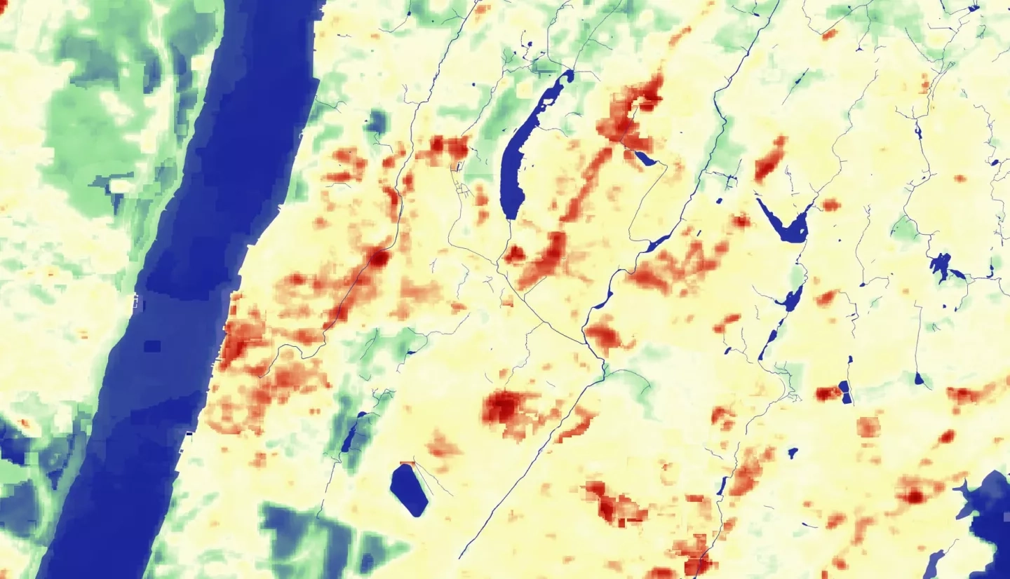 Mean Land Surface Temperature (LST) calculated using thermal imagery from Landsat 8 TIRS using open-source code from Emirda et al. (2020), on imagery from June-August 2015-2020. The city of Yonkers, NY sits to the bottom-center of the map, the Hudson River to the west and Long Island Sound to the east. Blue shows waterbodies, green displays areas of cooler LST, and orange/red areas display areas of hotter LST.  Keywords: Land Surface Temperature, LST, UHI, Urban Heat Island, Yonkers, New York, Landsat 8, TIRS, Westchester County, Jillian Walechka, Joseph Scarmuzza, Kathryn Greenler, Samain Sabrin, Tanya Bils