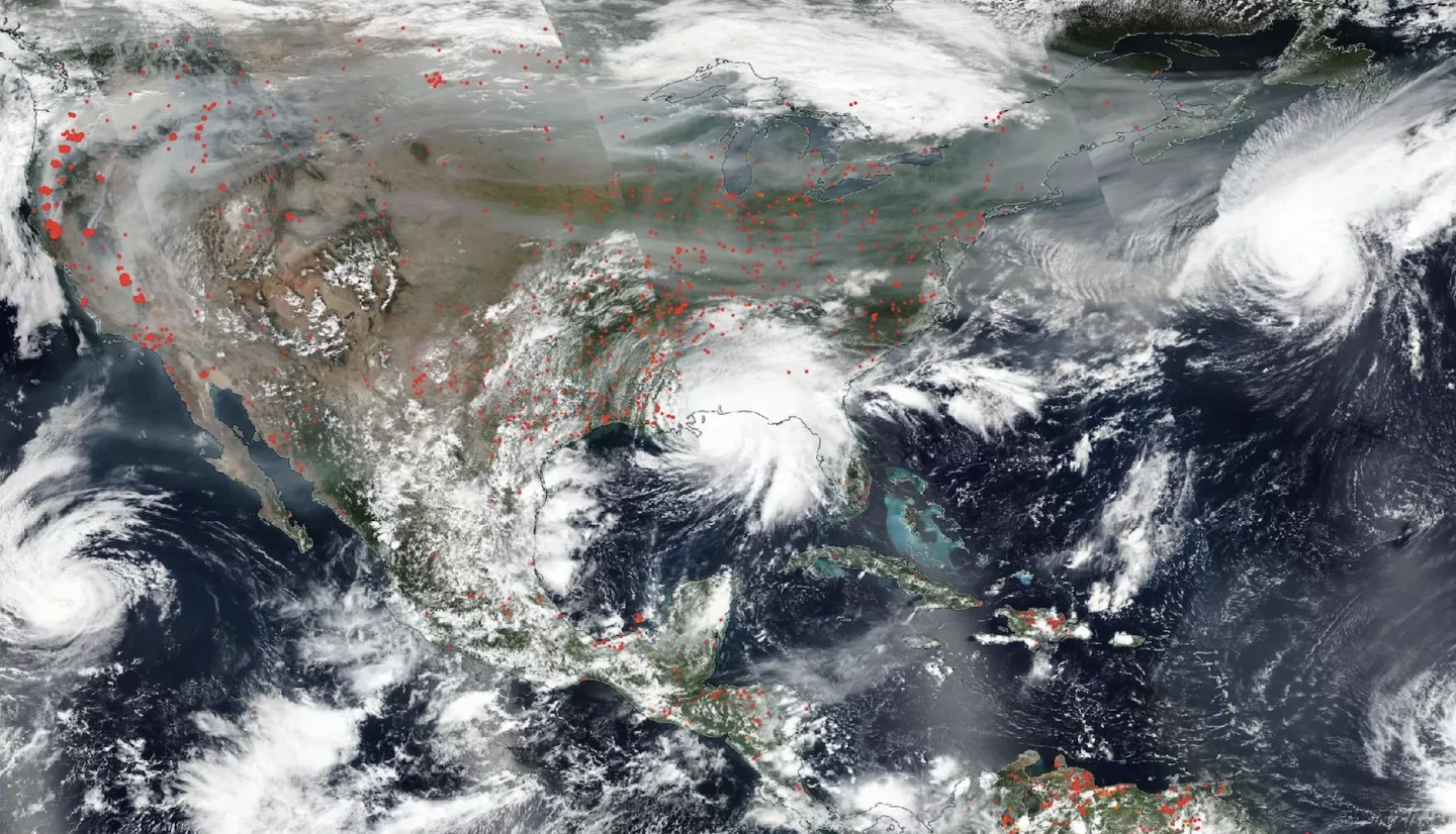 An image of the United States and Central America from September 2020, showing fires and their smoke in the west, several hurricanes converging, and Hurricane Sally making landfall. The true-color image was taken by NOAA/NASA’s Suomi NPP satellite.