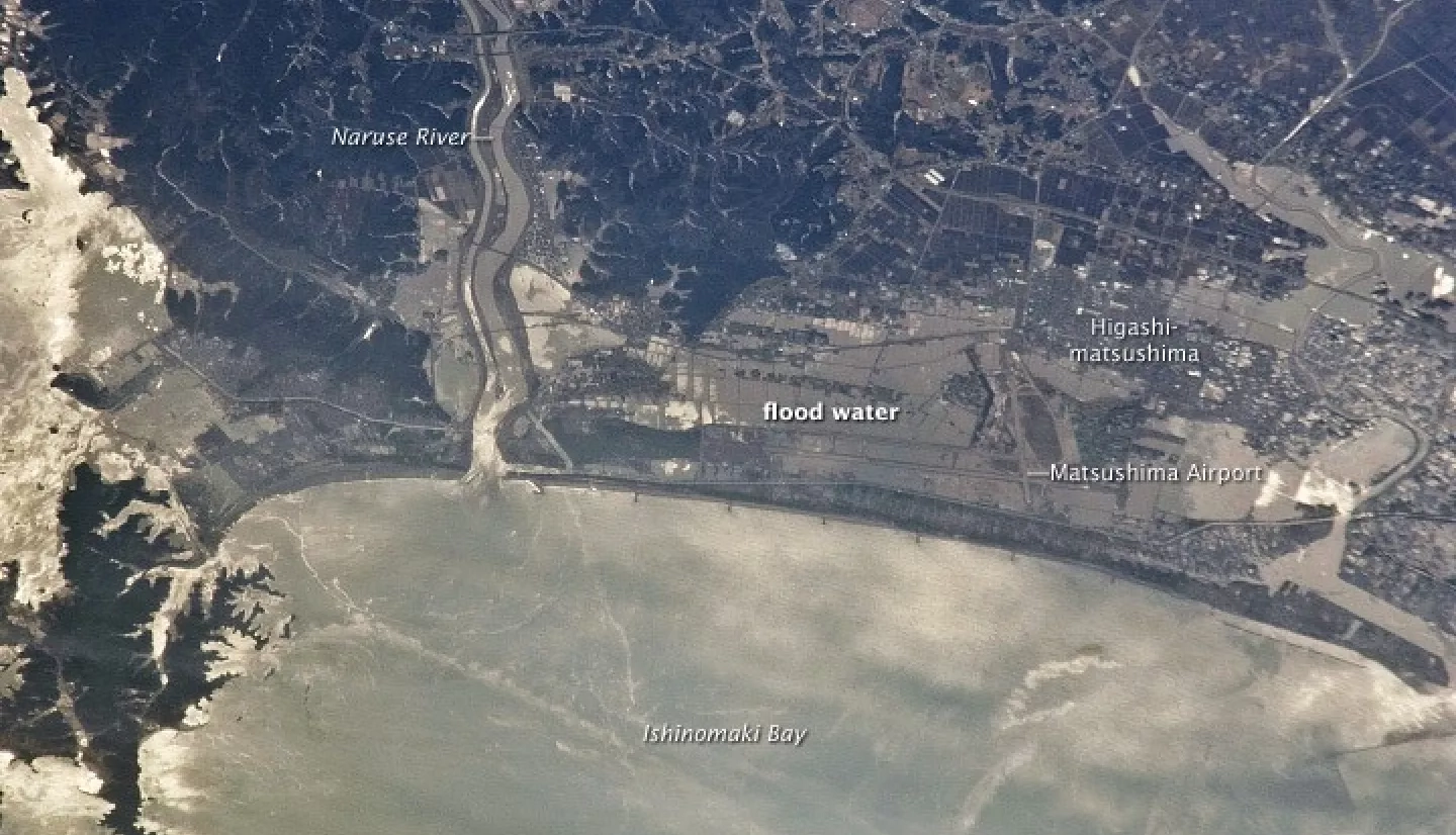 On Mar. 11, 2011, the eastern coast of Japan was shaken by the magnitude 9.0 Tohoku earthquake - one of the strongest earthquakes ever recorded. This photo, taken from the International Space Station on Mar. 13, 2011, shows the Japanese coastline north and east of Sendai following inundation by a tsunami. Sunglint indicates the widespread presence of floodwaters and indicates oils and other materials on the water surface.. Credit: NASA