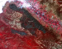 Captured by the ASTER instrument aboard NASA's Terra satellite, this false-color map shows the burn area of the River and Carmel fires in Monterey County, California. Vegetation (including crops) is shown in red; the burn area (dark blue/gray) is in the center of the image.