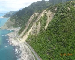 Photograph showing landslides covering State Route 1 near Ohau Point, New Zealand. Credits: USGS, Jonathan Godt