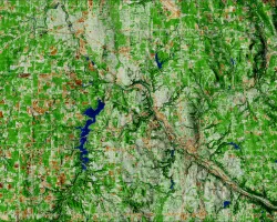 NDBI-processed imagery from a June 2022 Landsat 9 OLI-2 image. This composite image shows the cities of Warren (top left) and Youngstown (bottom right). The areas in white and brown represent the built environment. While areas in green represent land that is not as built-up, such as forest. Built-up areas can indicate where surface run off could occur, resulting in pluvial flooding.