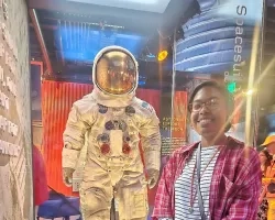 Elissa stands with Neil Armstrong’s space suit at the National Air and Space Museum in Washington, D.C. (Summer 2023)