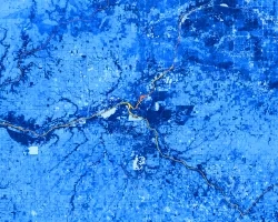 Normalized difference vegetation index (NDVI) calculated from Landsat 8 OLI showing land and aquatic vegetation around the Kankakee River in northeast Illinois on June 9, 2022. For land, dark blue represents high vegetation while light blue represents low vegetation. For water, light orange represents lack of aquatic vegetation, while purple represents the presence of aquatic vegetation. The image shows where along the Kankakee River aquatic vegetation exists. 