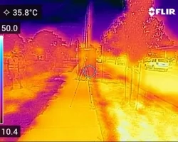 Thermal imagery of Denver bus stop in the afternoon displaying large variability in surface temperatures due to land cover types and shading. Tripods in center of image are recording wet and dry globe temperatures and windspeed. Combining fine-scale surface temperature data, with high-resolution land cover data, we can build a land cover regression to downscale Landsat thermal imagery for all metropolitan transit locations in Denver.  