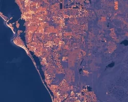  Land use land cover unsupervised classification derived from Landsat 9 OLI-2 TOA imagery acquired in spring 2023. The image shows the city of Lincoln, Nebraska. Lighter blue and greens show vegetation and agriculture, and darker blues show the urban area (left) invading the river (right). Heavily urbanized areas nearby rivers are at higher risk of flooding and are candidates for the Audubon Great Plains' environmental restoration and flood mitigation initiative.