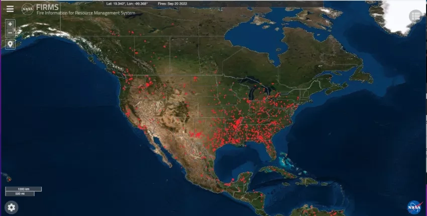 screenshot of the FIRMS website of a map of the U.S. with red dots showing fire hotspots as identified by satellite data